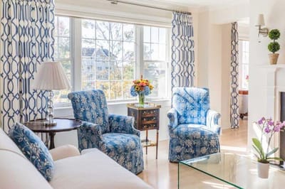 Bright, welcoming living area with floral arrangements
