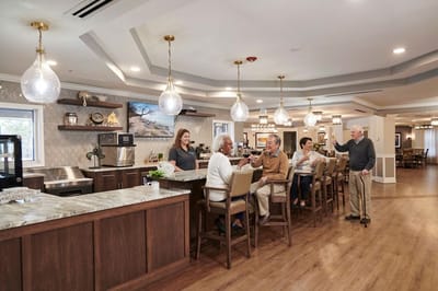 Residents interacting in a modern facility common area