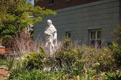 Statue in a garden outside the facility