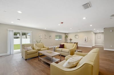 Bright common area with seating and natural light