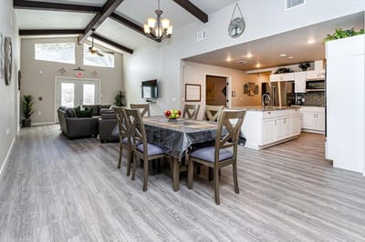 Interior view of a common area with dining table and seating