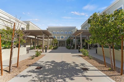 Exterior view of Volante Senior Living with outdoor seating areas