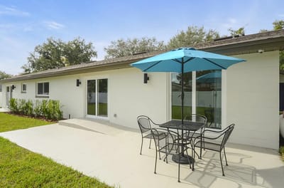 Outdoor patio area with table and chairs
