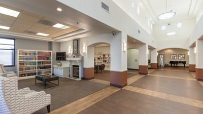 Bright common area with bookshelves and seating