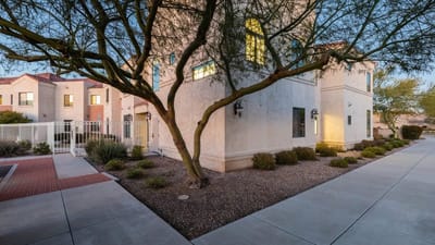 Exterior view of a senior living building with landscaping