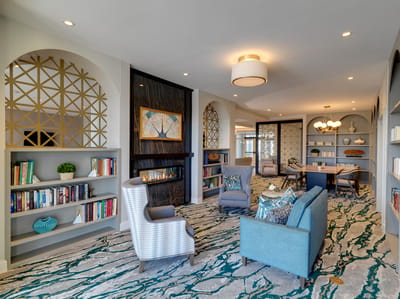 Cozy common area with seating and bookshelves