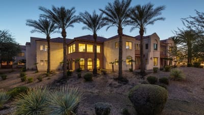 Exterior view of Solterra Senior Living surrounded by palm trees