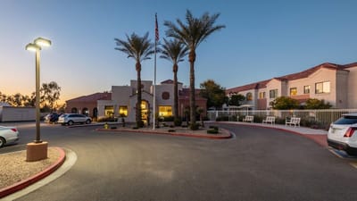 Exterior view of Solterra Senior Living at Chandler with palm trees