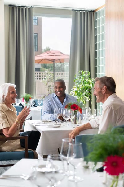 Residents enjoying a meal in the dining room