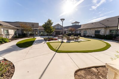 Outdoor courtyard with seating and landscaping