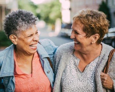 Two residents enjoying a joyful moment outdoors