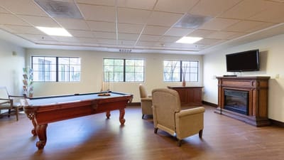 Interior view of a common area with a pool table