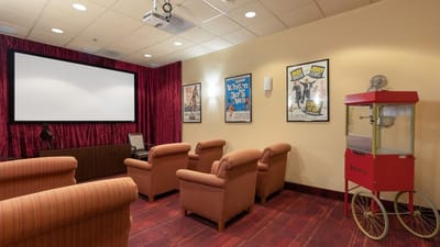 Bright interior of a movie room with comfortable seating