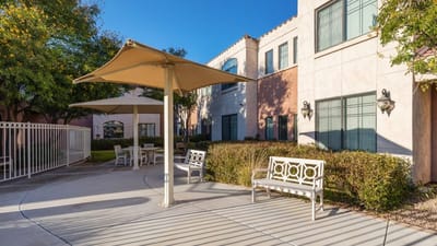 Shaded seating area in a garden for residents