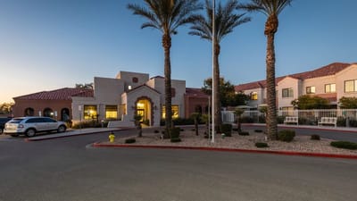 Exterior view of Solterra Senior Living at Chandler with palm trees