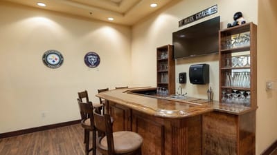 Bar area with seating and sports memorabilia