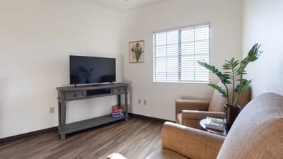 Cozy living area with seating and a television