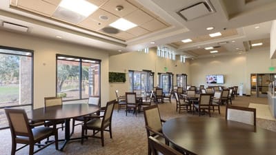 Bright dining area with tables and chairs