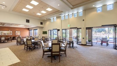 Bright dining room with plenty of seating and outdoor views