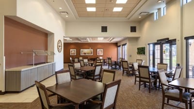 Bright dining area with tables and chairs