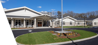 Building exterior of Waterstone of Lexington with landscaped entrance