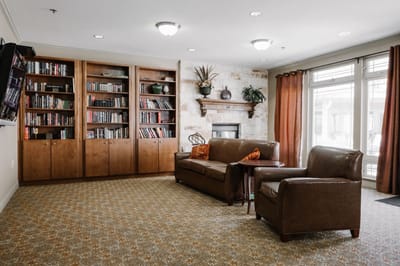 Cozy common area with a bookshelf and seating