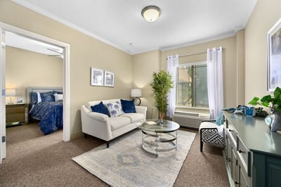 Cozy resident room with a sofa and bed