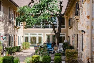 Outdoor courtyard with seating and greenery