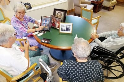 Residents reminiscing and enjoying ice cream at a table