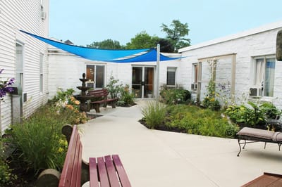 Outdoor garden area with seating and landscaping