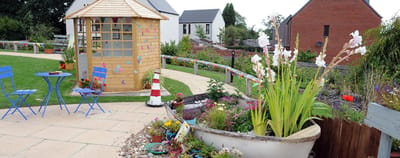 Garden area with seating and colorful decorations