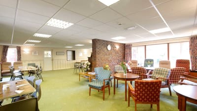 Bright common area with seating and tables