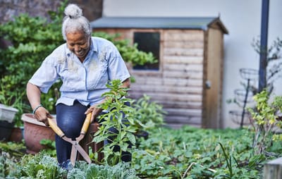 A resident gardening in an outdoor space