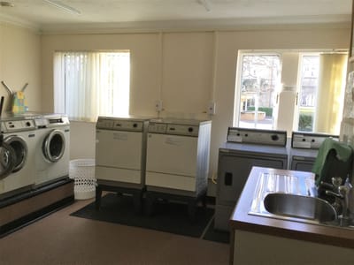 Laundry room with washing machines and utility sink