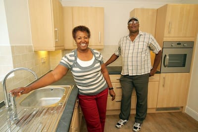 Two residents in a kitchen setting