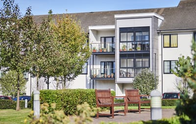 Exterior view of Pannel Croft Retirement Village with gardens and balconies