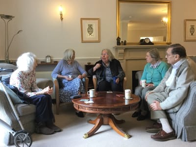 Residents engaging in conversation in a common area