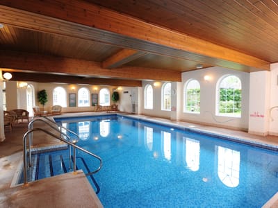 Indoor swimming pool area with natural lighting