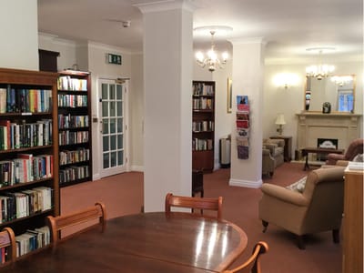 Interior view of a common area with bookshelves and seating