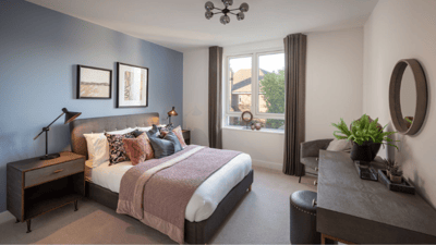 Well-furnished resident bedroom with natural light