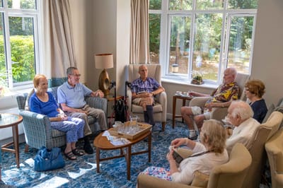 Residents engaged in conversation in a common area