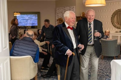 Residents enjoying a lively gathering in a common area