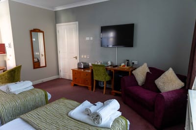 Cozy resident room with beds and seating area