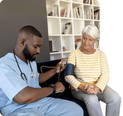 Healthcare professional checking a resident's blood pressure