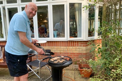 Resident grilling food outdoors at Melton Court
