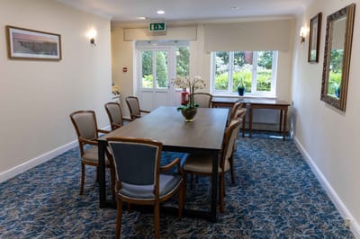 Interior common area with dining table and chairs