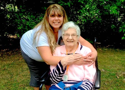 Caregiver and resident enjoying time outdoors