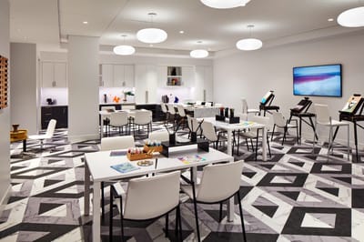 Bright common area with tables and modern decor