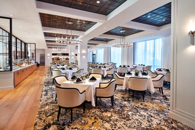 Elegant dining room with tables set for meals
