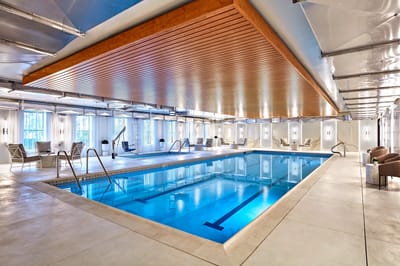 Indoor swimming pool with lounge seating